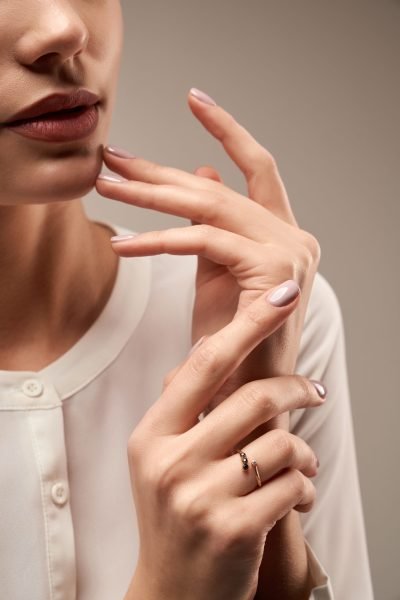 young model demonstrating expensive ring.